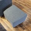 Leolux Calinda fauteuil met poef - Zijaanzicht links