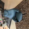 Leolux Cream fauteuil met poef - Zijaanzicht links